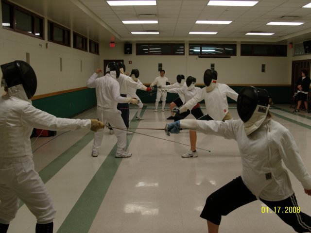 Coach Don Uy observing line drills